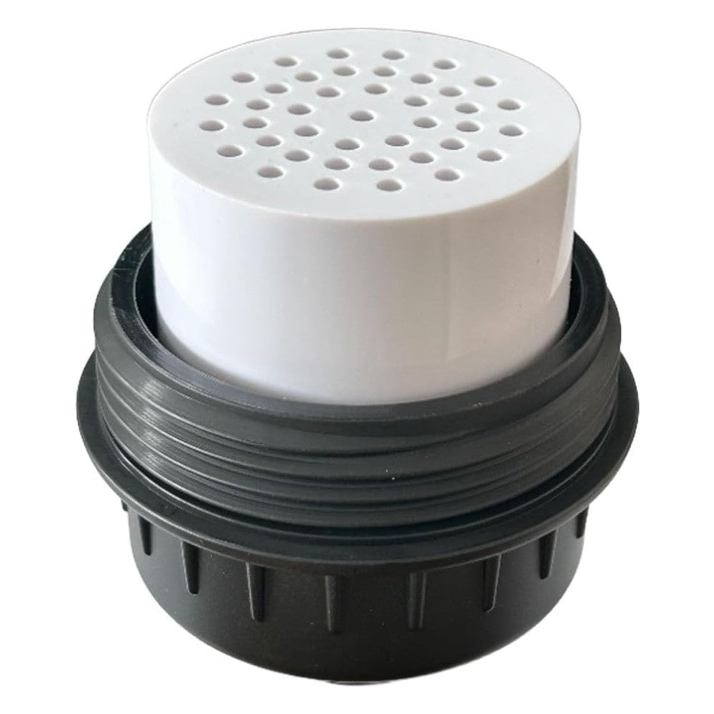 Close-up of the replaceable filter cartridge seated in the base of the matte black housing