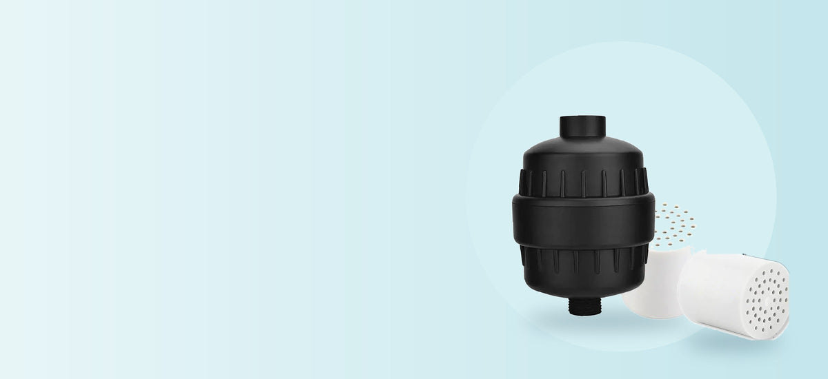 Aqua Soft filtered shower head kit with replacement cartridge on a soft aqua background